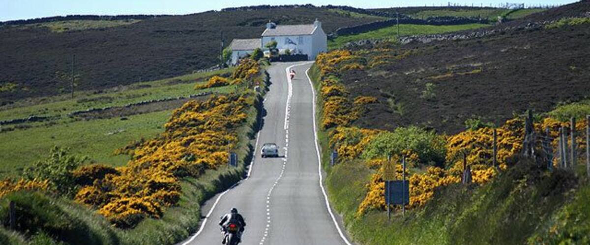 Kate's Cottage. Seen along the straight section of the TT course just NW of Creg-ny-Baa.