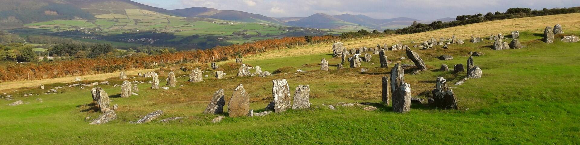 The remains of an Iron Age roundhouse and two Norse long houses at a single location in the Isle of Man