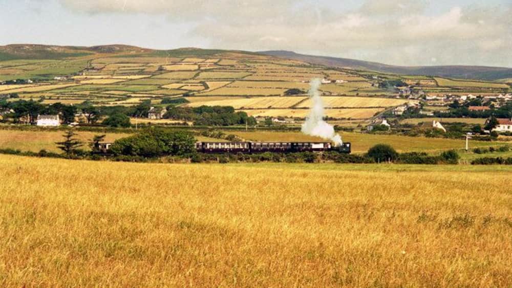Isle of Man Railway A Douglas-bound train is seen across the fields between Port Erin and Port St. Mary.