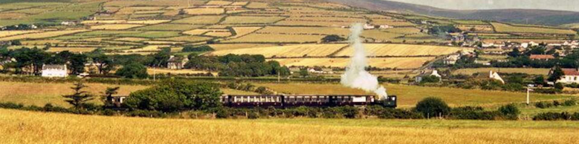 Isle of Man Railway A Douglas-bound train is seen across the fields between Port Erin and Port St. Mary.