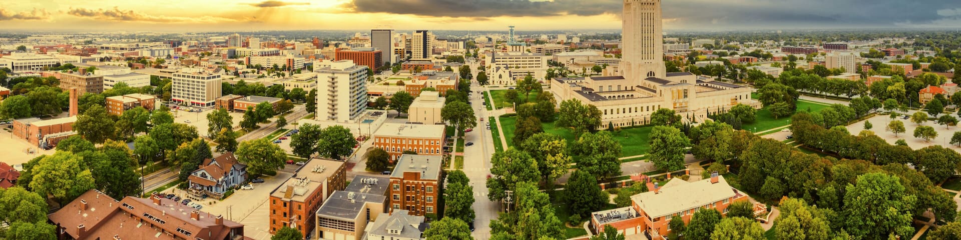 Aerial panorama of Lincoln, Nebraska under a dramatic sunset. Lincoln is the capital city of the U.S. state of Nebraska and the county seat of Lancaster County