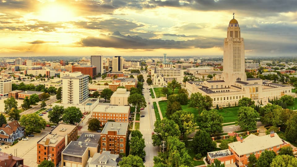 Aerial panorama of Lincoln, Nebraska under a dramatic sunset. Lincoln is the capital city of the U.S. state of Nebraska and the county seat of Lancaster County