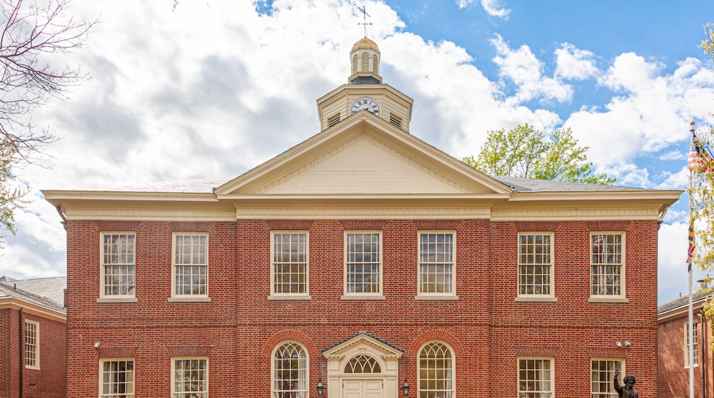 Easton ,MD, USA 04-16-2021: historic Courthouse building is among the oldest landmarks in the beautiful small town of Easton. Brick building has Talbot County Seals on both side of the entrance door.