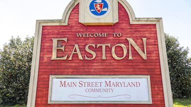 The western entrance of the historic picturesque small town of Easton, MD, center of Talbot County. A landmark with coat of arms is erected on US route 50 that says welcome to Easton.