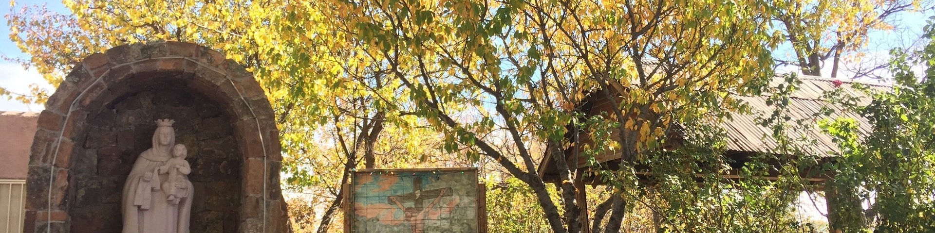 Santos adorn the grounds of El Paragua, a lovely historic restaurant in the heart of Española, New Mexico for a peaceful retreat from daily woes