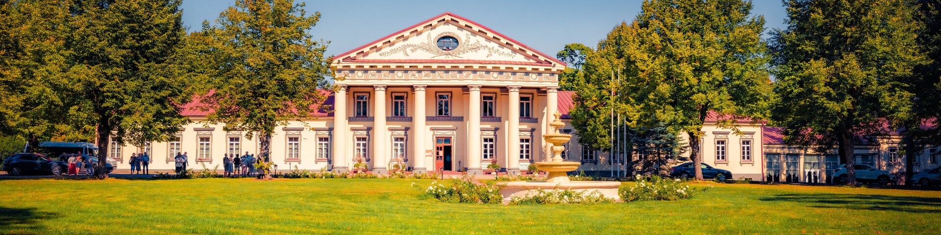Panoramic afternoon view of Taujenai palace, Ukmerge District Municipality. Coorful summer scene of Lithuania, Europe. Traveling concept background.