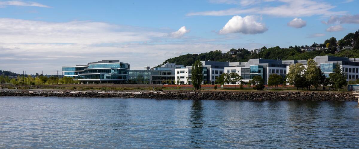 Seattle, Washington, USA - June 4 2021: Seattle skyline Expedia Group during summer. View from Elliott Bay. Space Needle. Washington state.