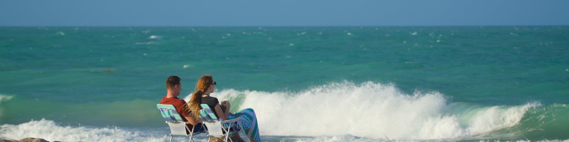 Vero Beach showing a sandy beach and general coastal views as well as a couple