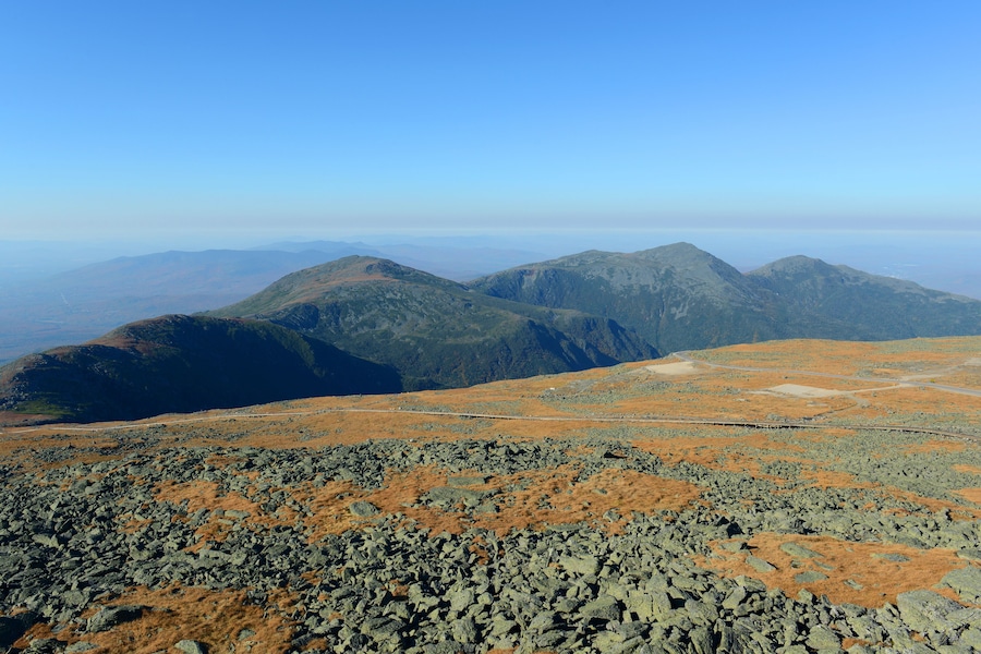 Mount Jefferson (left), Mount Adams (middle), and Mount Madison (right) in fall with foliage from summit of Mount Washington, White Mountains, New Hampshire, USA.