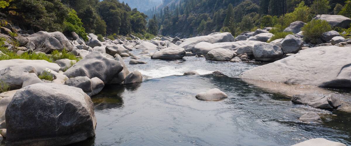 The beautiful Feather River flows through a scenic canyon in Northern California' Sierra Nevada Mountains. This beautiful flow of water is the principal tributary to the Sacramento River.