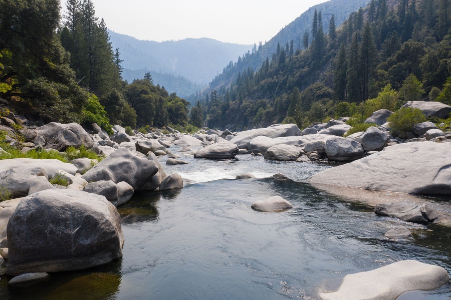 The beautiful Feather River flows through a scenic canyon in Northern California' Sierra Nevada Mountains. This beautiful flow of water is the principal tributary to the Sacramento River.