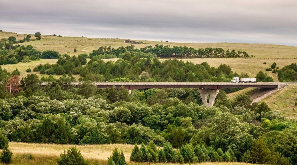 Semi-trailer truck crossing bridge along Nebraska Highway 12, also known as Outlaw Trail Scenic Byway, outside Valentine, Nebraska, USA, on a cloudy day in summer; Shutterstock ID 1482824018
