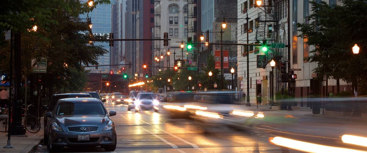 Lincoln Highway showing night scenes and a city