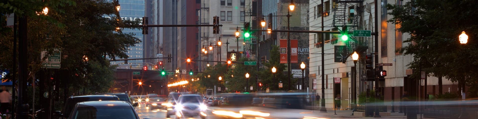 Lincoln Highway showing night scenes and a city