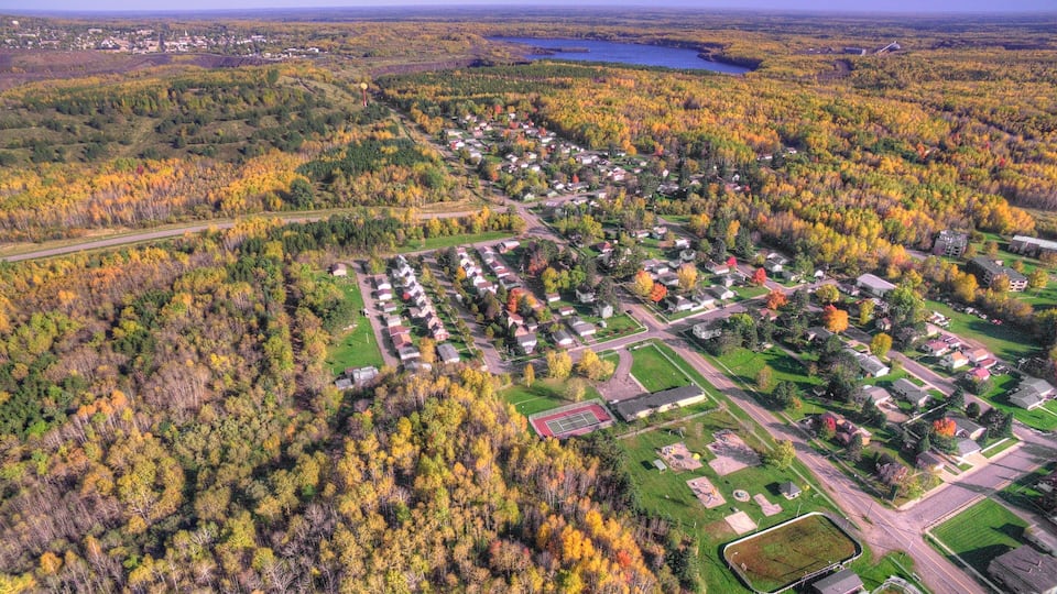 Small Town New Eveleth, Minnesota in Autumn seen by Drone