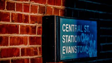 Sign on a red brick wall for Central Street Evanston station