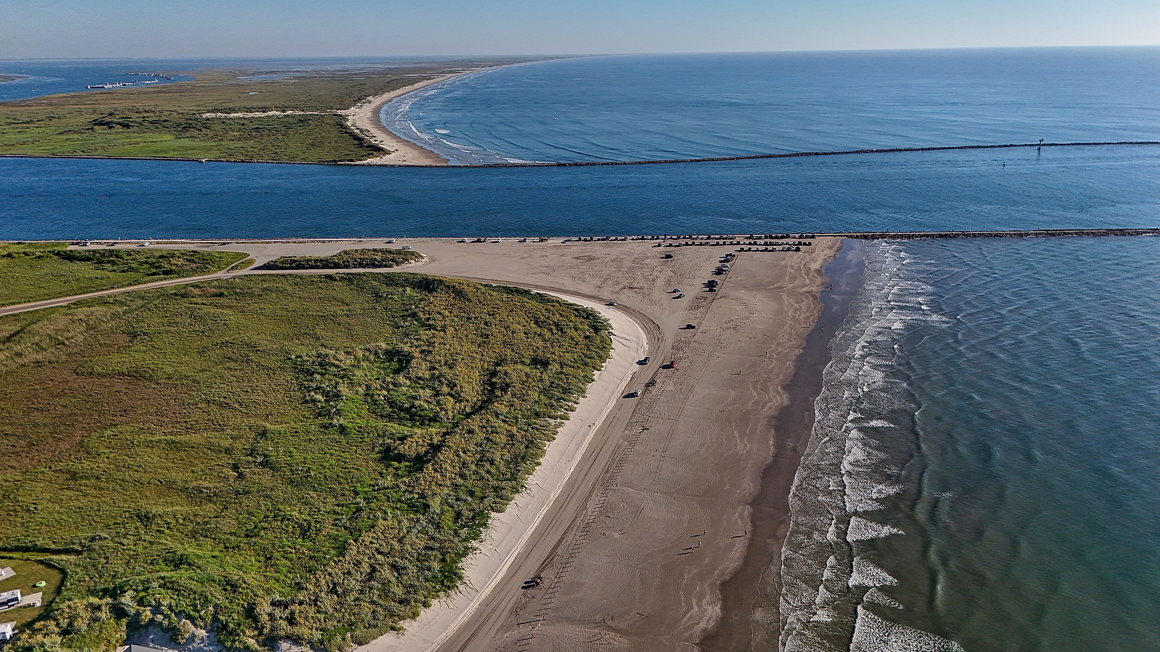 The waves large and small continue to lap on shore of the beaches along the Gulf of Mexico in Port Aransas. Beach goers enjoy the sun, surf, birds, sea shells, sea turtles, and fishing.