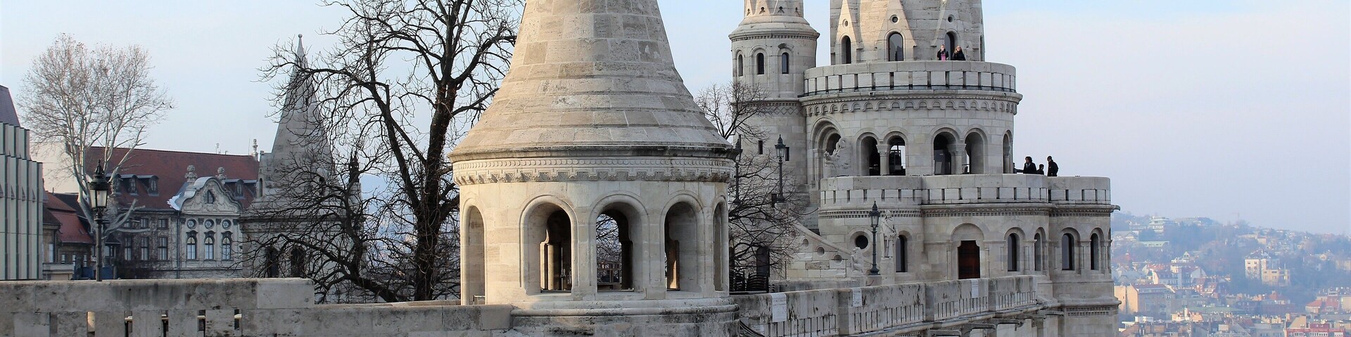 Fisherman's Bastion is a terrace in neo-Gothic and neo-Romanesque style situated on the Buda bank of the Danube, on the Castle hill in Budapest, around Matthias Church. It's seven towers represent the seven Magyar tribes that settled in the Carpathian Basin in 895. It was designed and built between 1895 and 1902 on the plans of Frigyes Schulek. Between 1947–48, the son of Frigyes Schulek, János Schulek, conducted the other restoration project after its near destruction during World War II.
My favorite place in Budapest! I took this photo in March 2018. And it's merely one part of the Fisherman's Bastion.