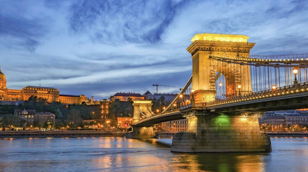 Old Budapest is magical at twilight. This is an image of the Chain Bridge from the east bank (south of the Bridge) with Buda Castle on the hill overlooking the City in the left background. If you go to Budapest, sit on the bank of the River Danube at twilight and enjoy the view. A wonderful place for lovers! If you would like to see more of my Budapest photos, go to the link below.
https://gailmitchell.smugmug.com/Vienna-Very-Best-for-Smug-Mug3?mobile=true