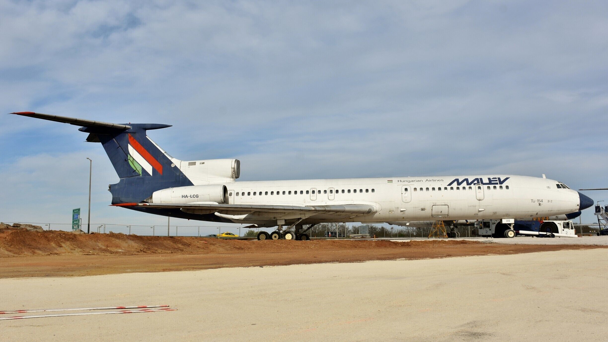 A Hungarian Airlines Tu-154 aircraft on a runway.