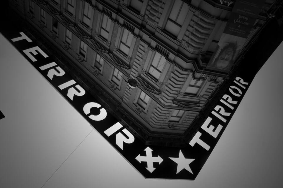 A building facade with a large sign reading "TERROR" and a star symbol.