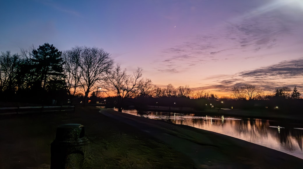 Sunset over the pond at the Northfield Hills Condo association at the corner of Long Lake Road and Coolidge Highway in Troy, Michigan, a suburb of Detroit partly cloudy winter day