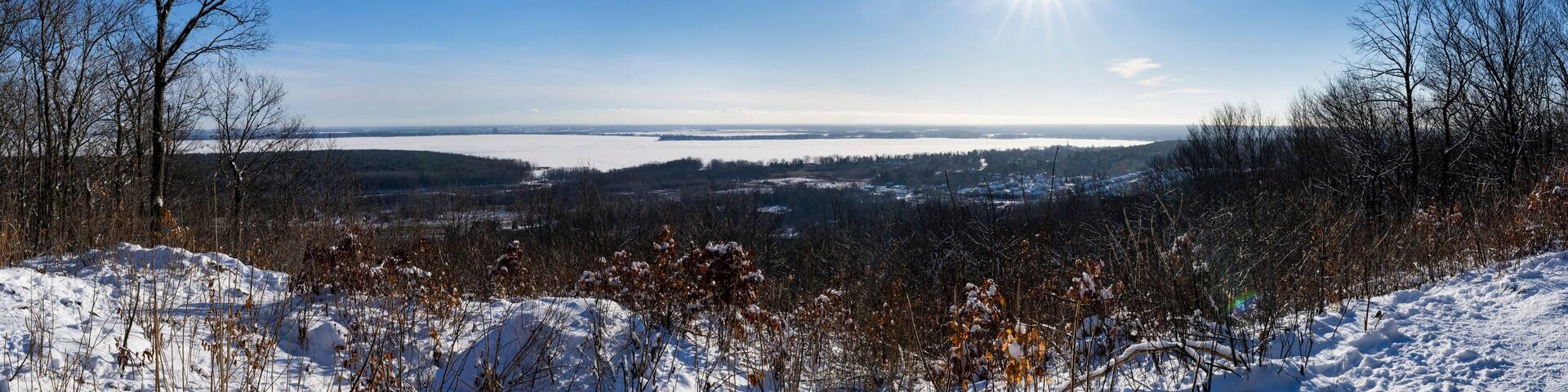 Panoramic view of Lac des Deux Montagnes during a beautiful winter sunny day in Quebec, Canada