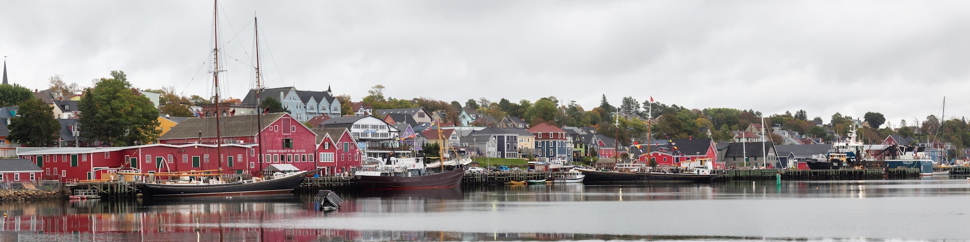 Lunenburg, Nova Scotia, Canada - October 7, 2018: Beautiful view of a historic port on the Atlantic Ocean Coast during a cloudy day.