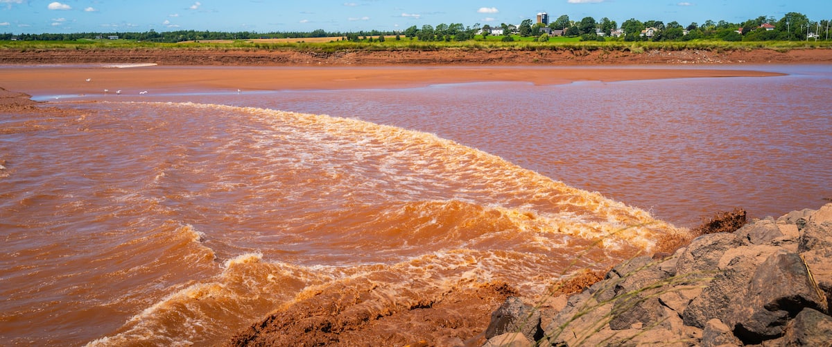 Tidal Bore at Fundy Discovery Site in Truro with oceanside tides traveling upstream on the Salmon River in Nova Scotia, Canada
