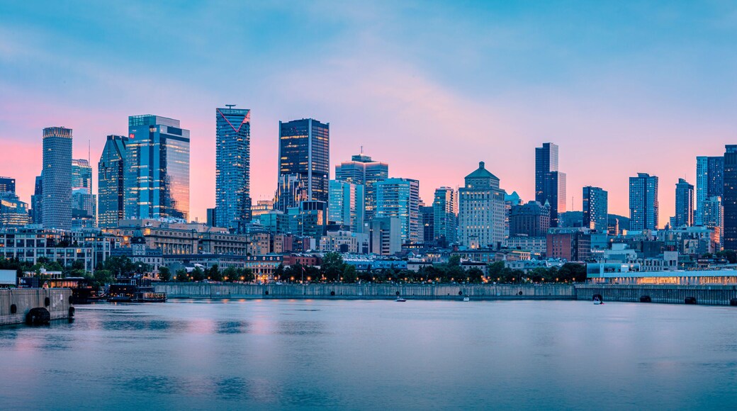 Panoramic view of the Montreal skyline at dusk from the Old Port, downtown skyscrapers along the Saint Lawrence River waterfront, Quebec, Canada