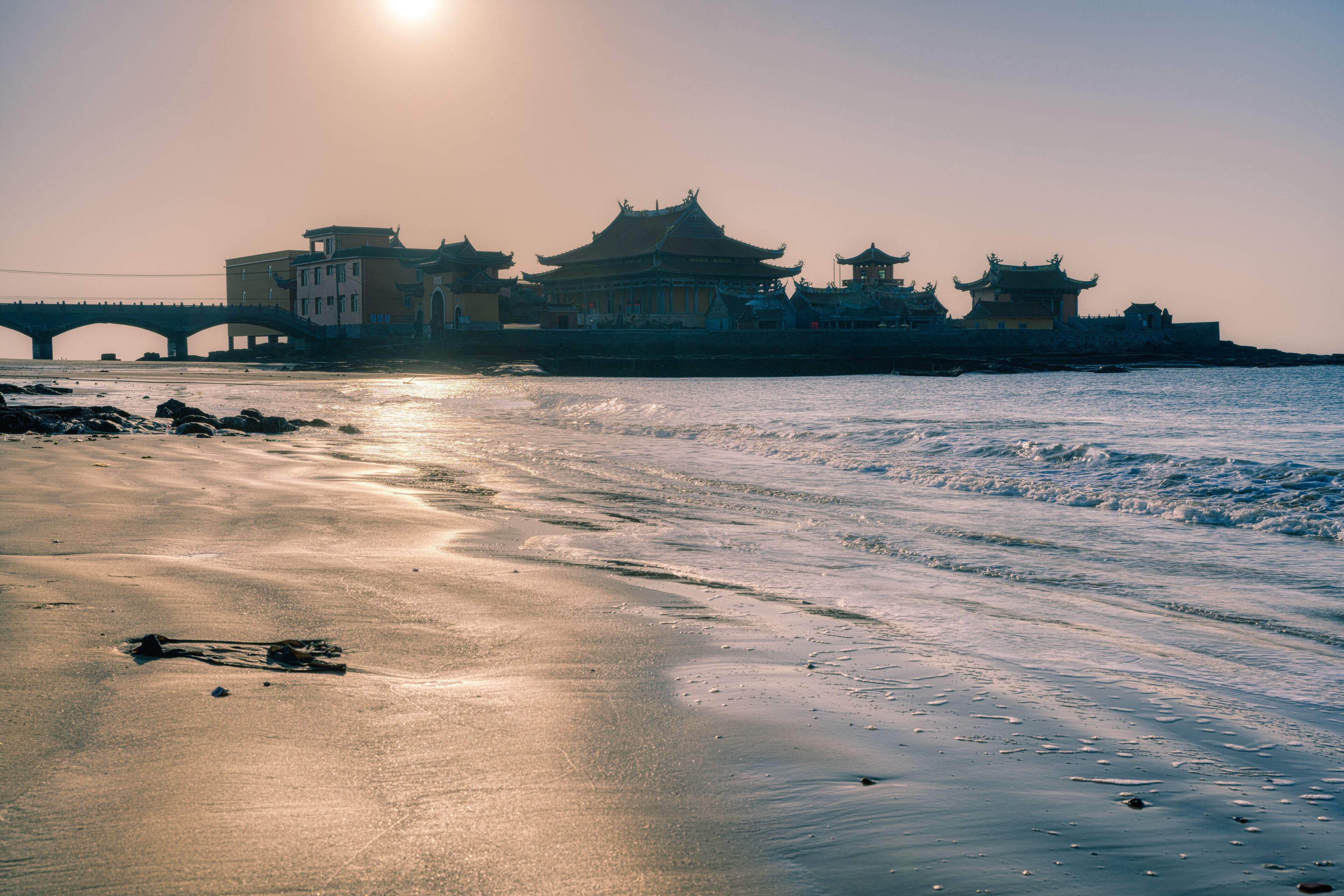 A temple on the sea in sunrise. The temple locates in Quanzhou, Fujian, China.