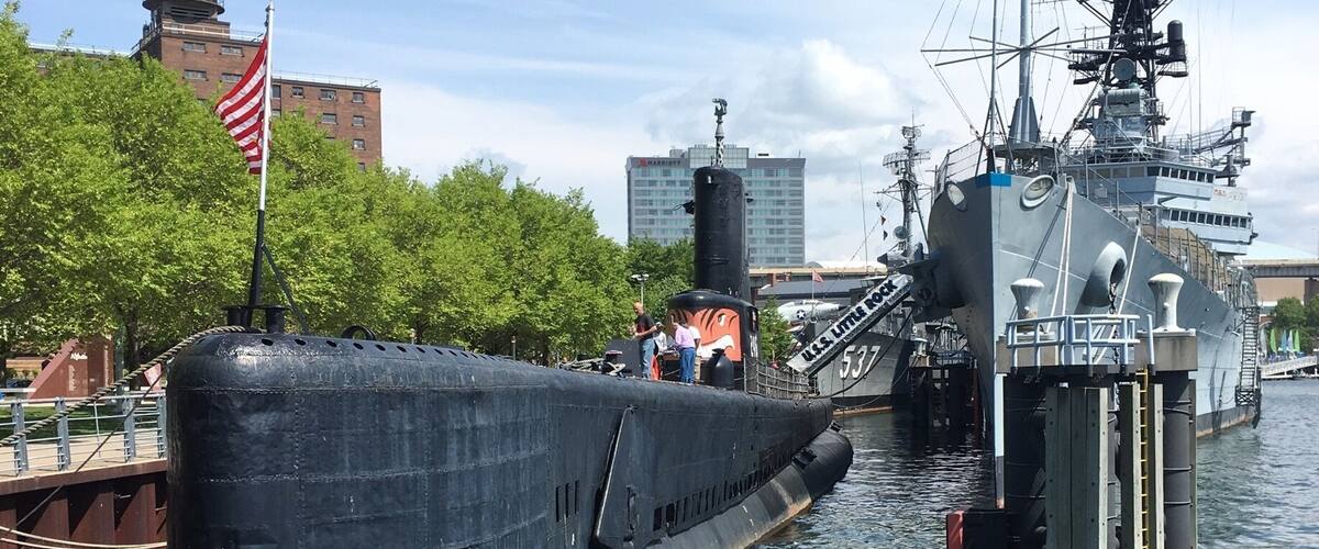 Marina with couple planes, Submarines, Attack boats, and other military ships. Can also get a tour of some of the ships for a price. Great for a walk on a hot day as you feel a breeze from the water. Also a large field along marina filled with wooden lawn chairs to relax in and enjoy.
