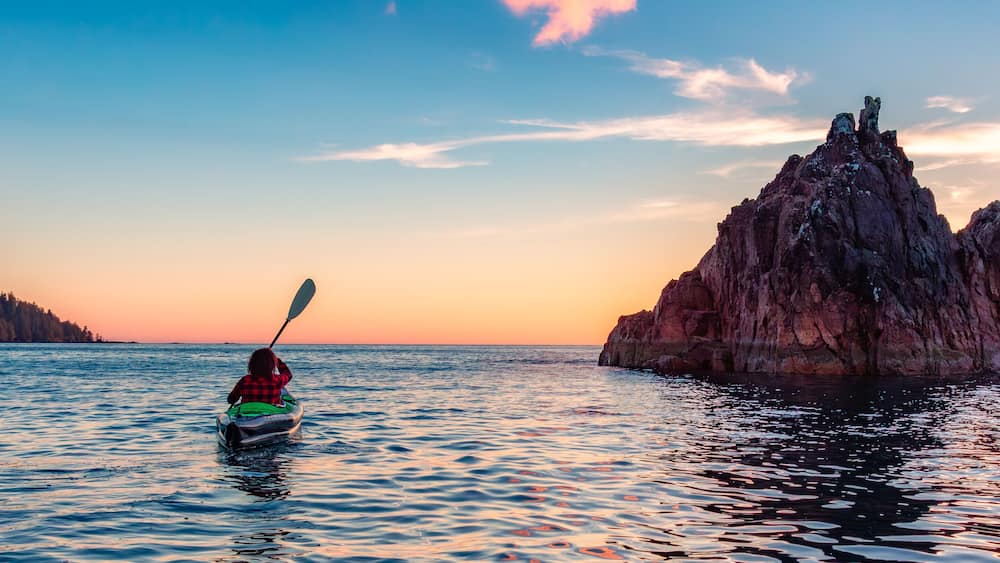 Kayaking in Canadian Nature Landscape on the West Coast of Pacific Ocean.
