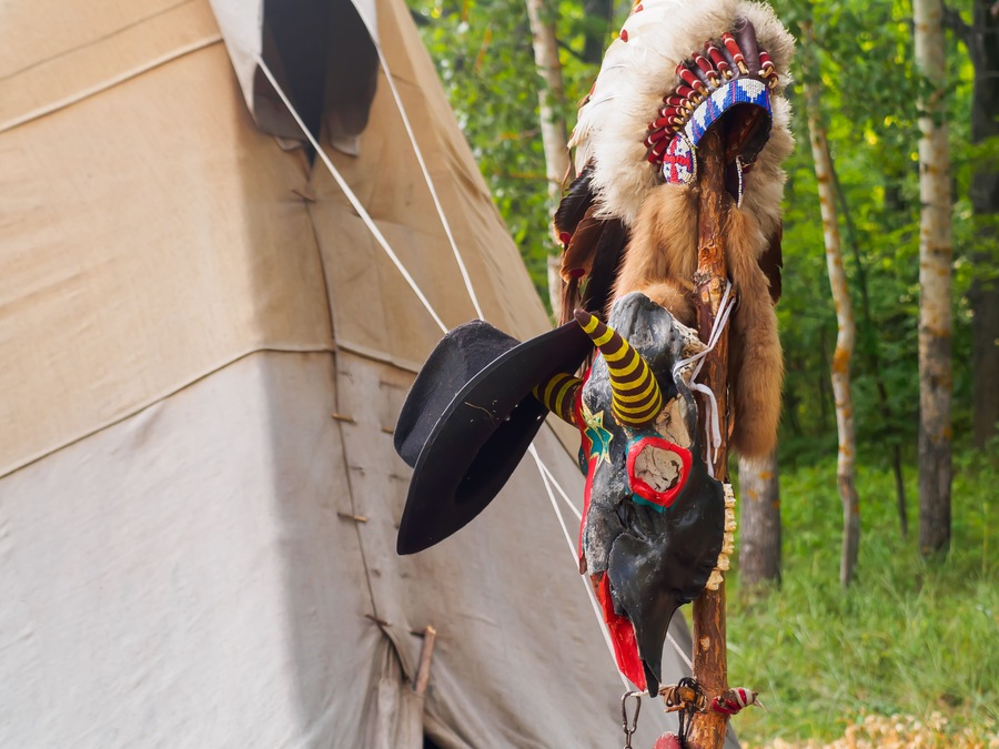 Forest home of the Indians. Wigwam indian teepee. The life of nomadic tribes. The wigwam stands in the forest. A hut of nomadic peoples. A home of Indians. tippi aka in the forest.