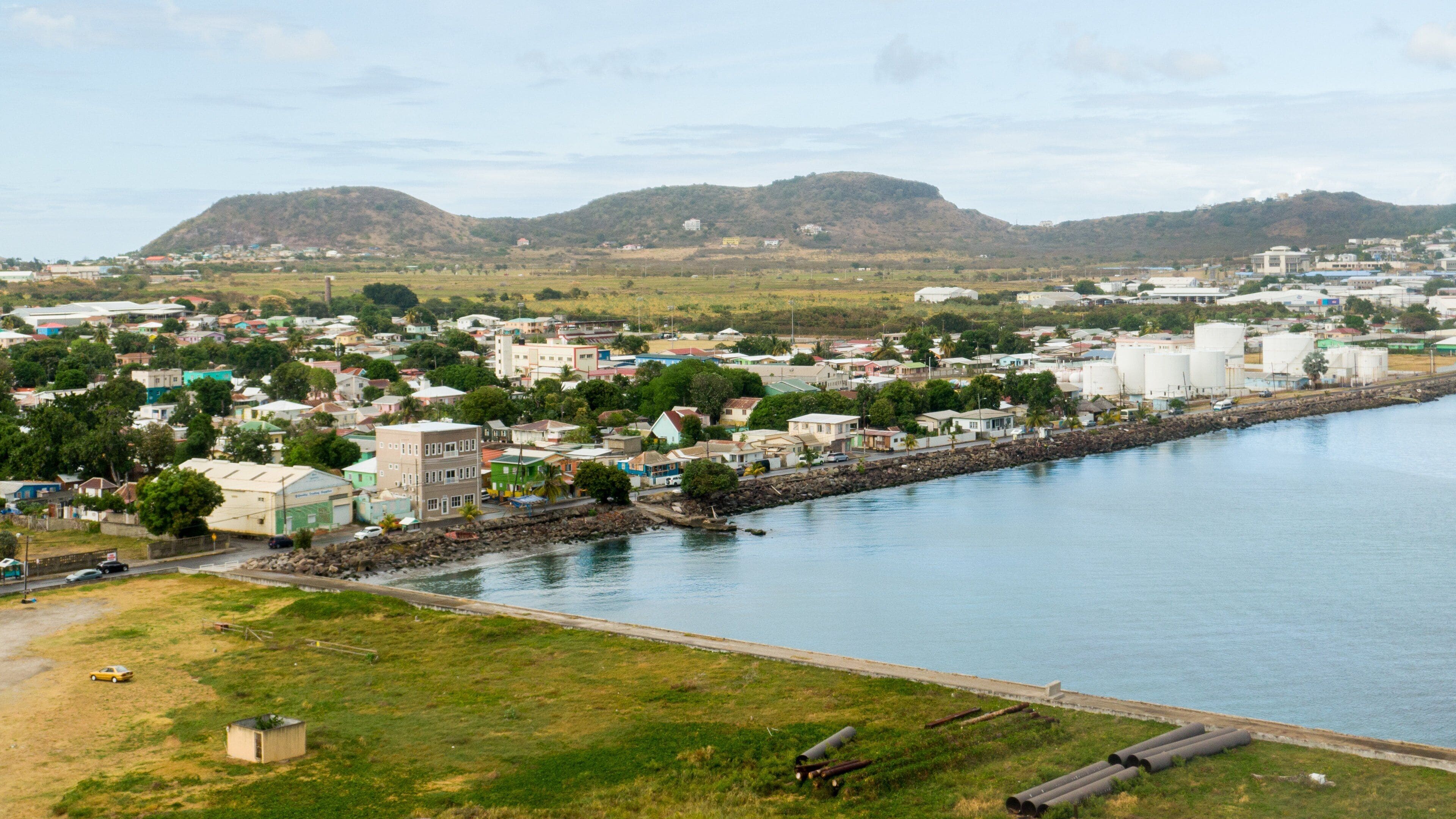 Frigate Bay which includes a bay or harbor, a coastal town and tranquil scenes