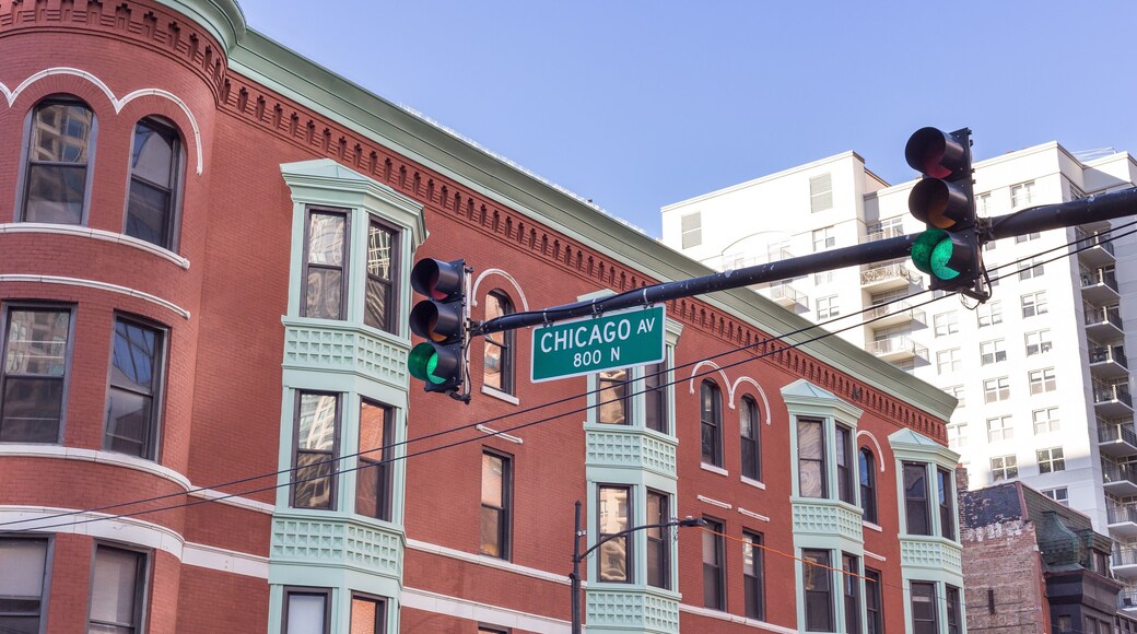 Chicago Ave. street sign in front of vintage building in uptown Chicago