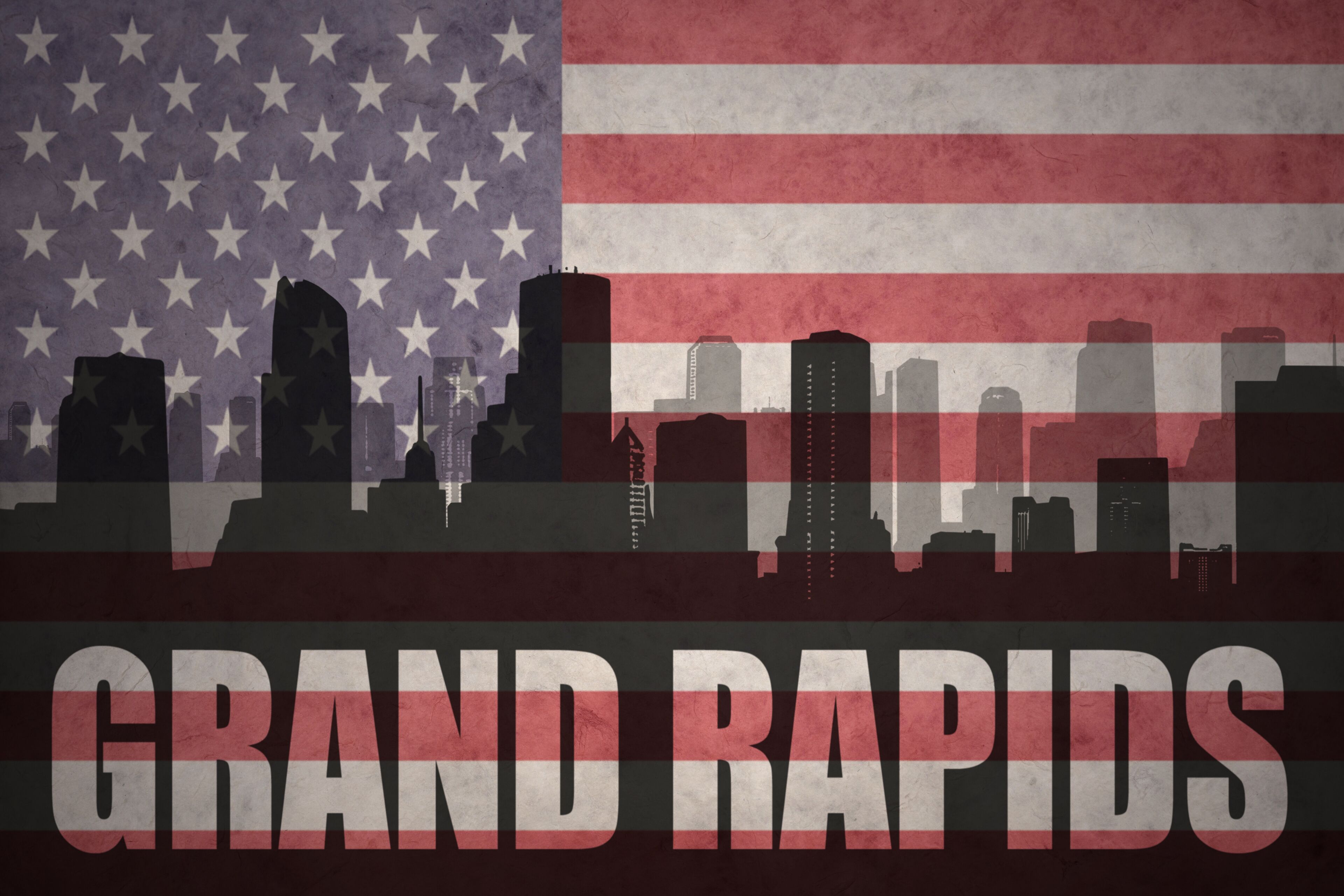 abstract silhouette of the city with text Grand Rapids at the vintage american flag