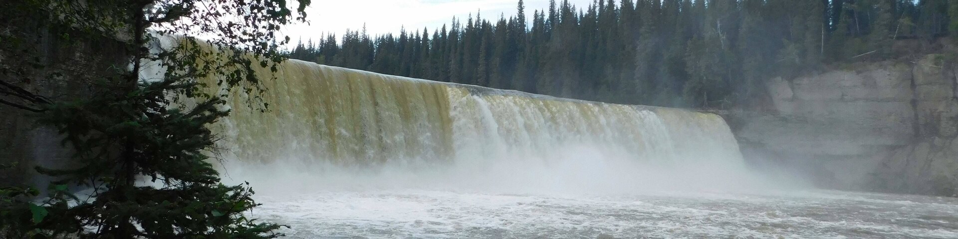 The falls from a ground view. You can climb/hike to the bottom of the falls, they are to strong to go behind, but it is amazing to be beside. The rock behind the falls is filled with shell fossils.