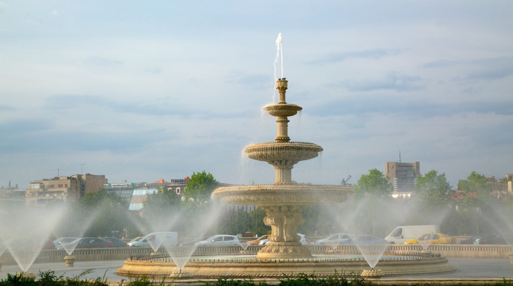 Bucharest showing a city and a fountain