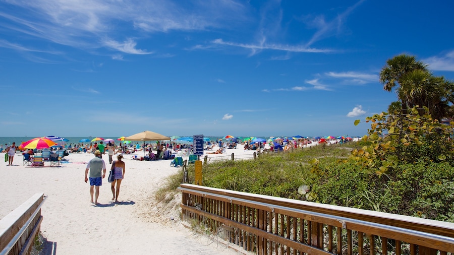 Fort Myers Beach showing a beach as well as a small group of people