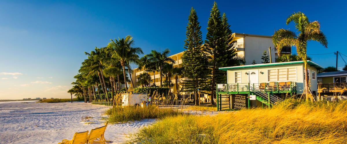 Sand dunes and buildings on the beach in Fort Myers Beach, Florida.