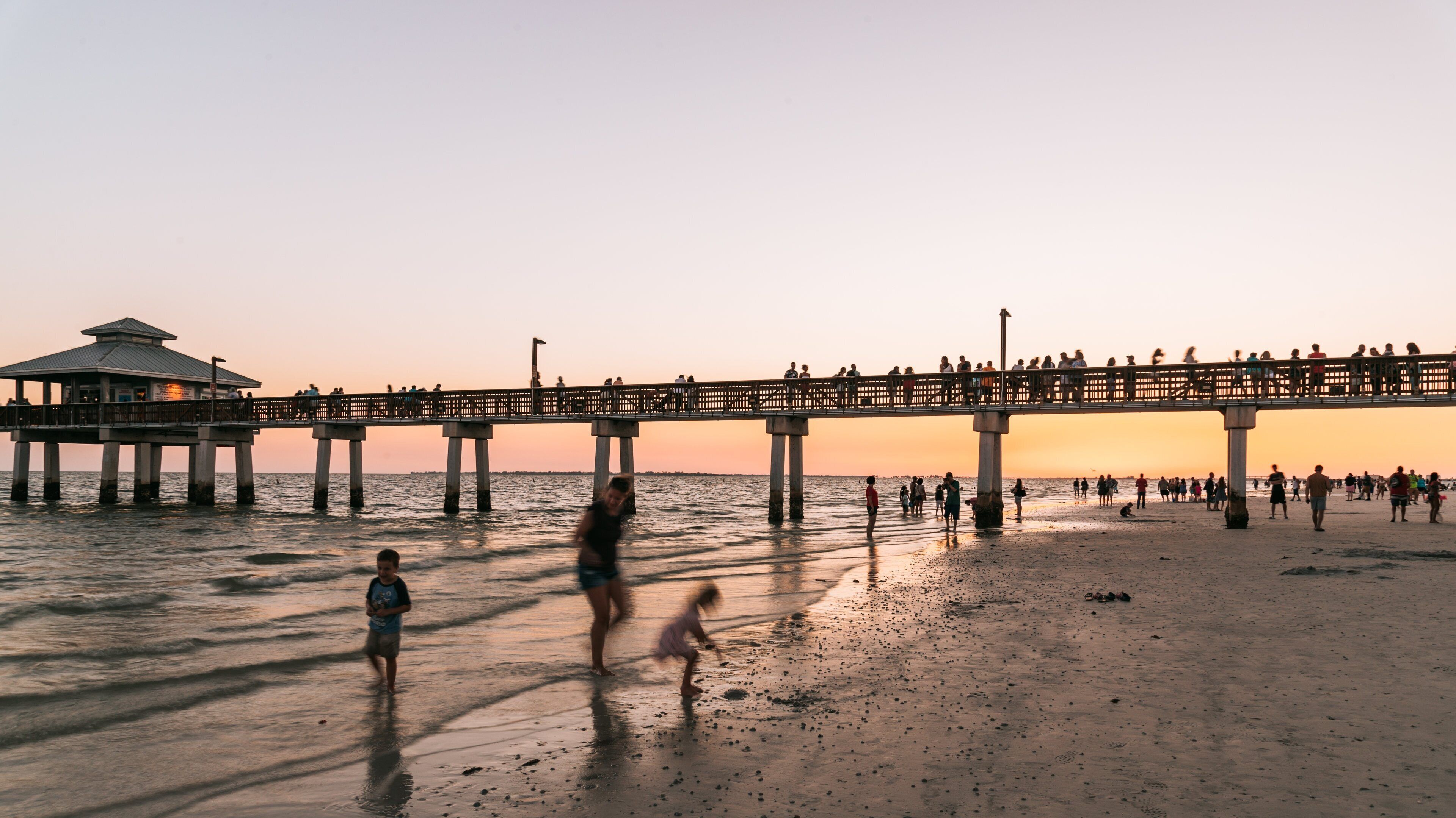 Fort Myers Beach featuring general coastal views, a sunset and a sandy beach