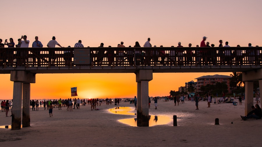 Fort Myers Beach featuring a sunset, a bridge and a beach