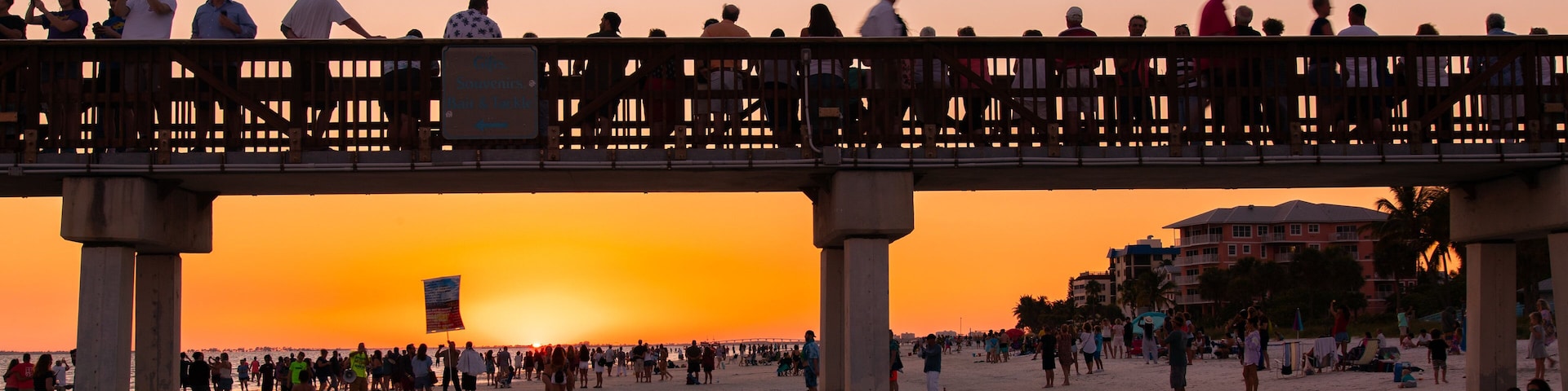 Fort Myers Beach featuring a sunset, a bridge and a beach