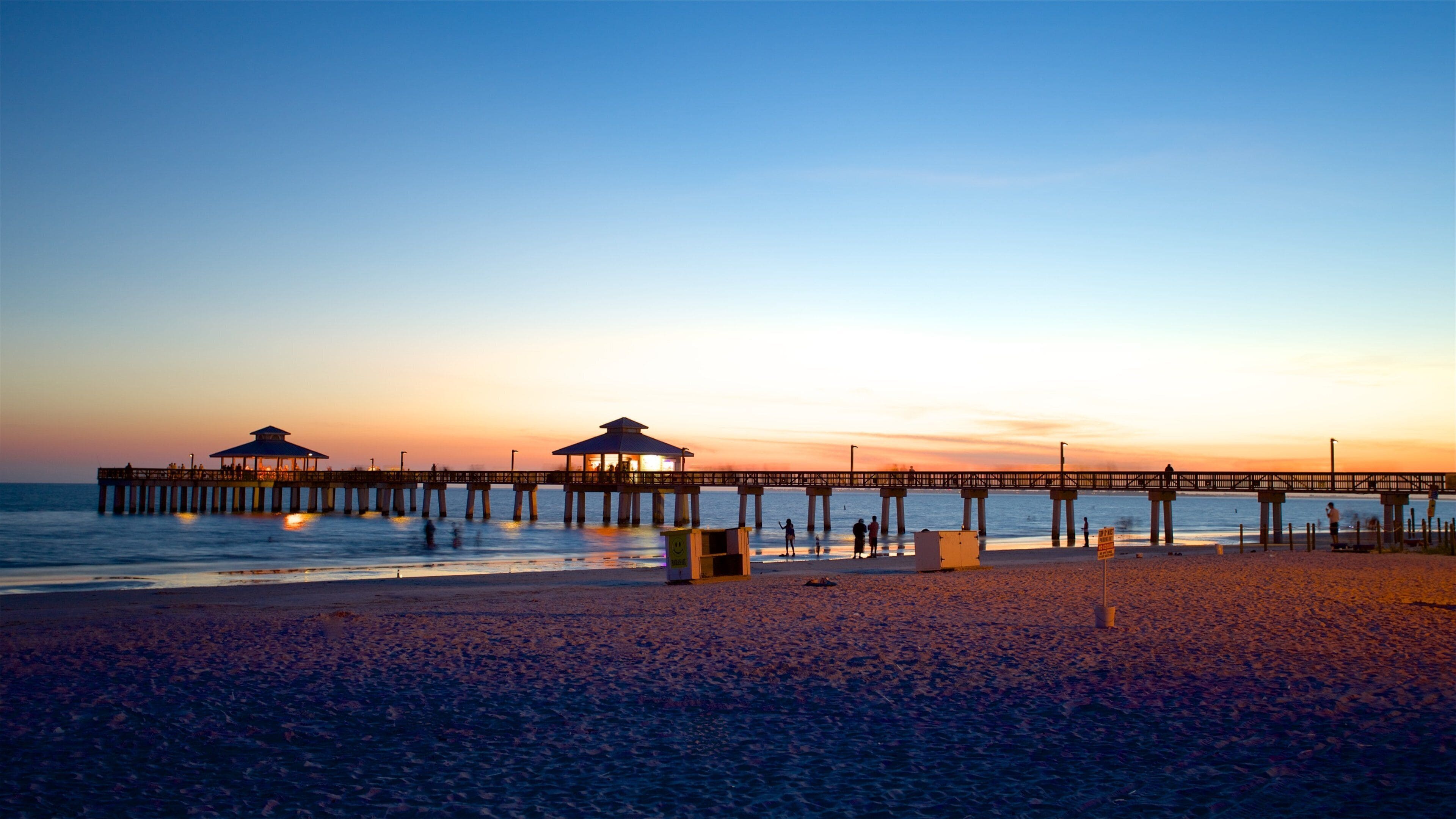 Fort Myers Beach showing a sunset and a beach
