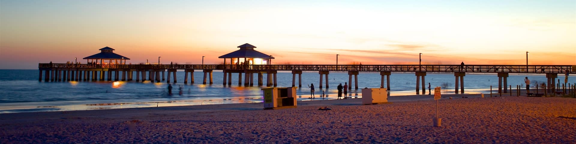Fort Myers Beach showing a sunset and a beach