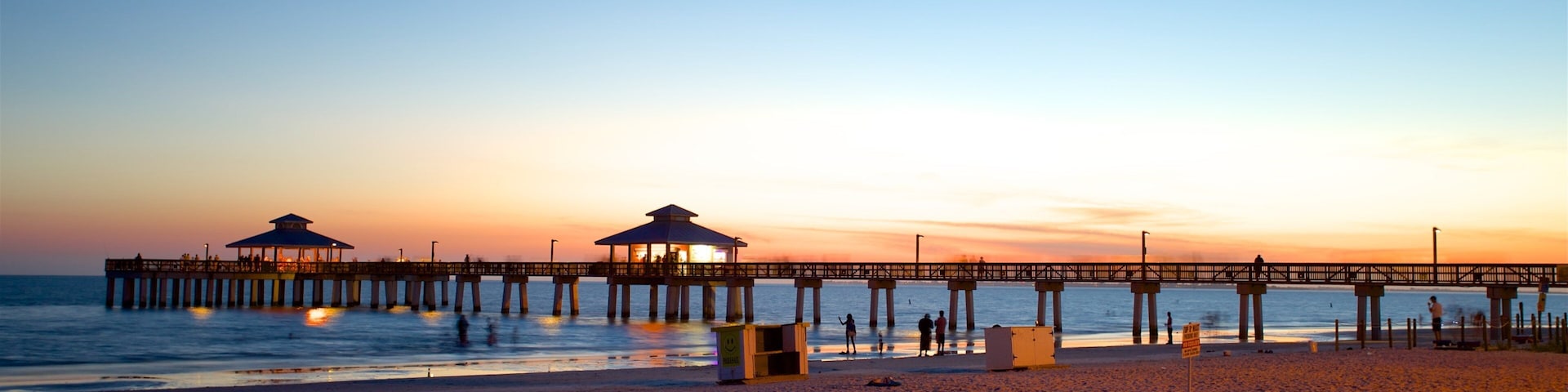 Fort Myers Beach showing a sunset and a beach