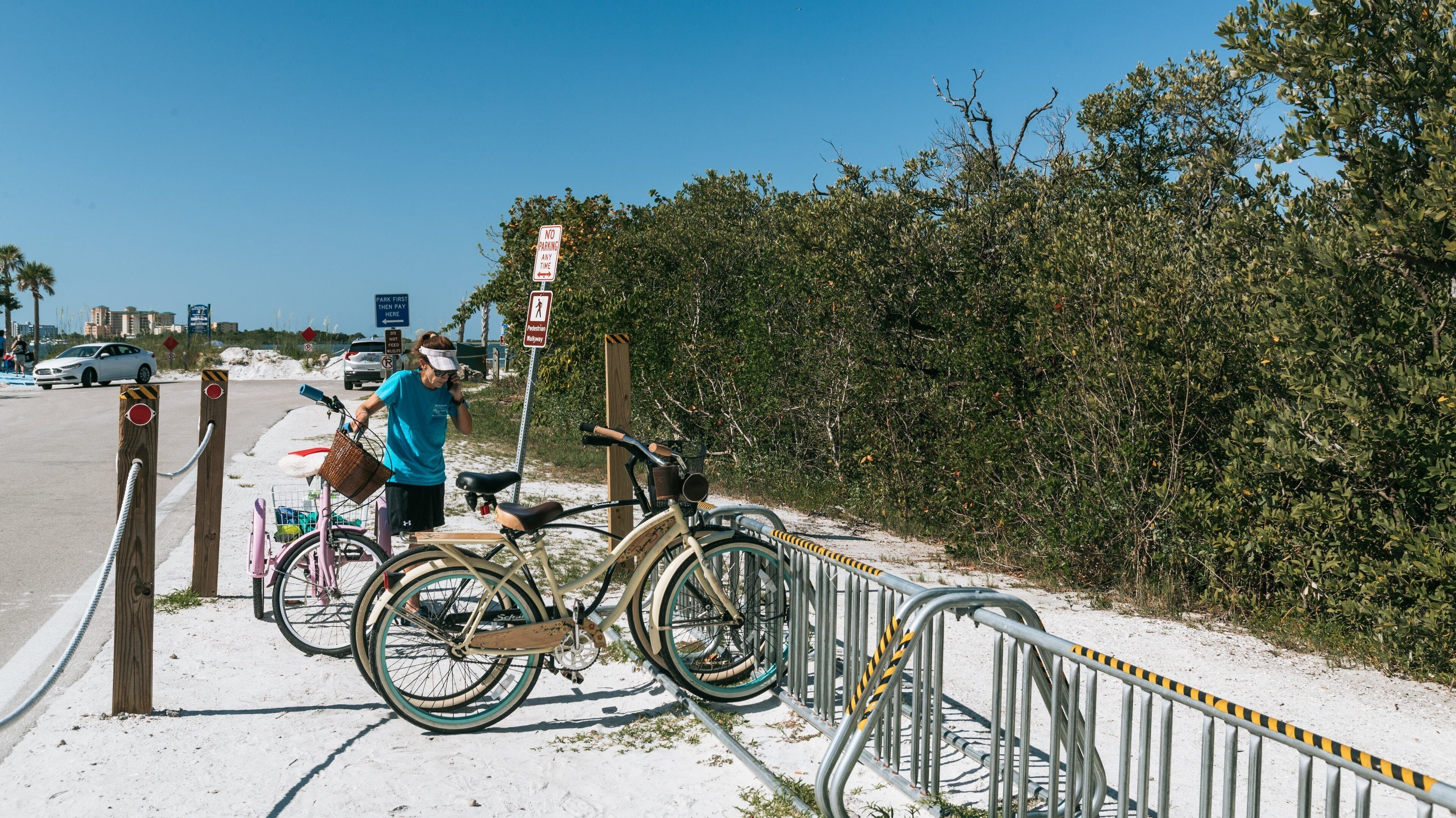 Fort Myers Beach featuring a beach as well as an individual femail