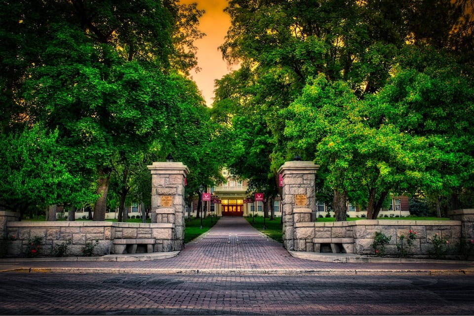 A paved pathway leading to a building with a sign reading "SOUTHERN UNIVERSITY."