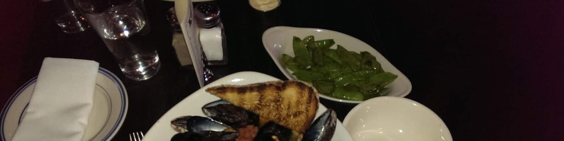 The mussel appetizer here is PLENTY for one person's entree, and sooo tasty. It has some kick with spicy chorizo and jalapenos. They serve a big helping of hearty bread to soak up all the browth. Great beer list here too.